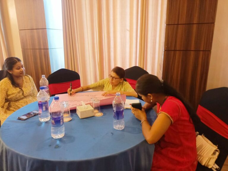 Group work by participants during the issue identification workshop.