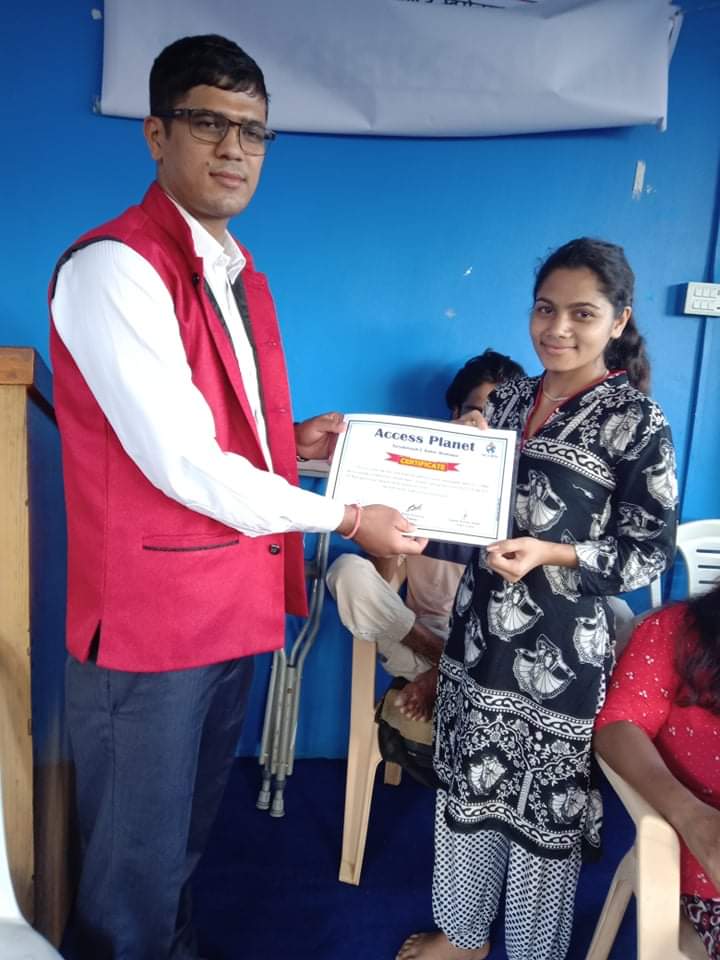 Computer trainee receiving certificate from computer trainer Mr. Arjun Acharya.
