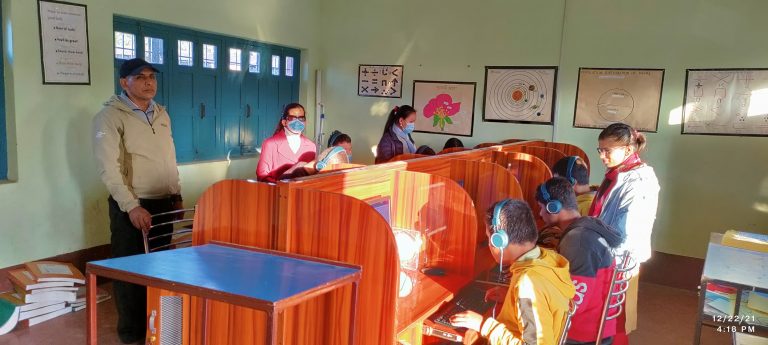 Ms. Jhuma Mishra teaching computer to school students of Gyan Chakshu School, Dharan.