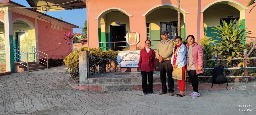 Group photo with the Principal of Gyan Chakshu School, Dharan