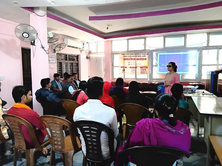 "Laxmi Nepal is speaking at the front while all participants are attentively listening, as captured in the photo."