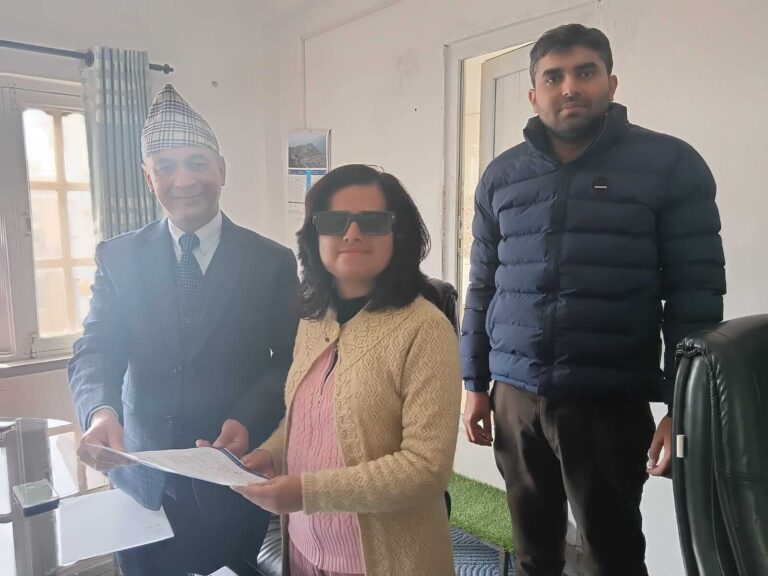 Three individuals, including Laxmi Nepal, are presenting an attention letter to the director of the DOIT, Ramesh Sharma Paudel and computer engineer Chandra Shekhar are there