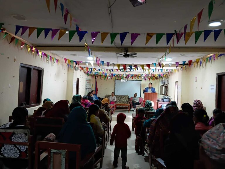 Deputy Mayor of Athabiskot is addressing the interaction program from the front, with all participants visible in the photo.