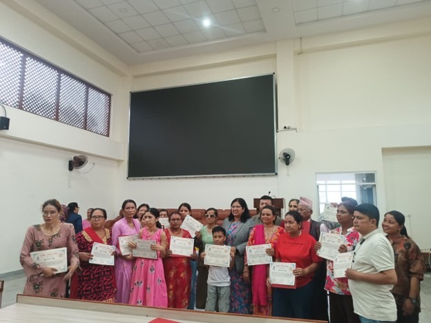Participants Standing in group with certificate in their hands with Laxmi Nepal, Executive Director of Access Planet Organization and Ms. Sarita Timilsina Bhattarai, Deputy Mayor of Suryabinayak Municipality.