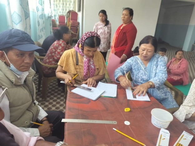 Pictures of participants learning to make nepali bag